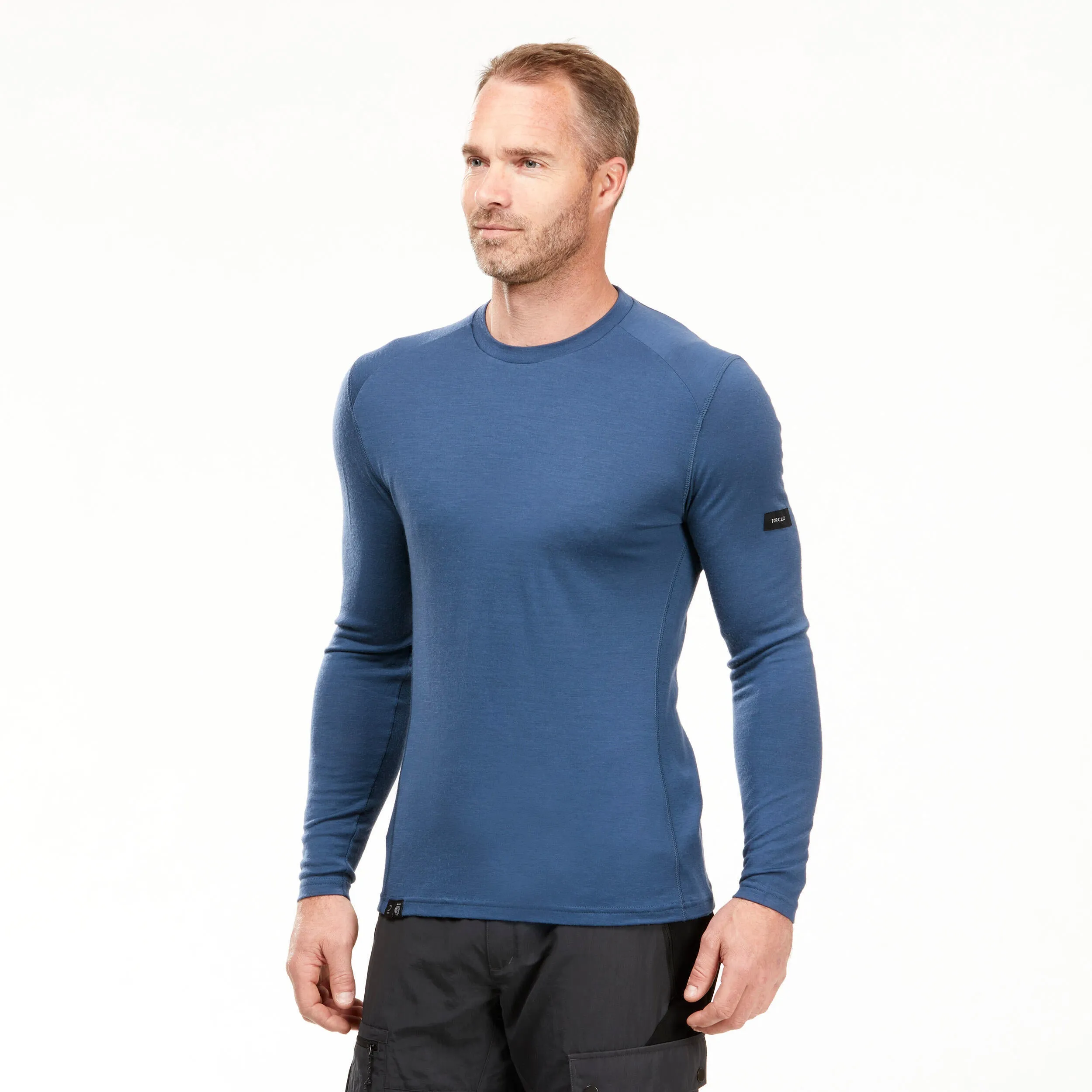 Men's longsleeve made of Forclaz merino wool for mountain trekking, blue